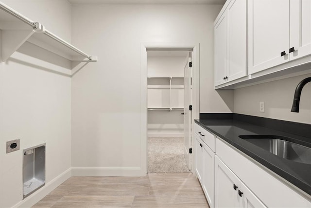 11713 NW 105th St, Yukon, OK 73099 - laundry room featuring hookup for an electric dryer, cabinet space, and baseboards