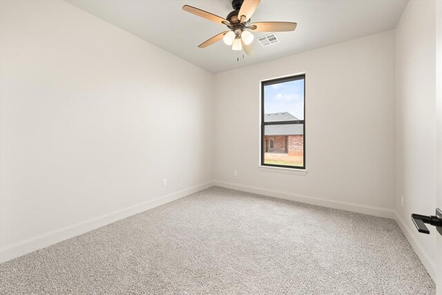 11713 NW 105th St, Yukon, OK 73099 - spare room featuring light carpet and baseboards