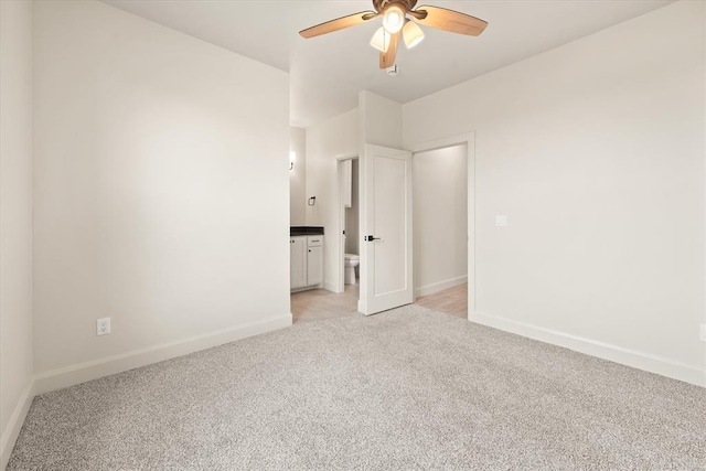 11713 NW 105th St, Yukon, OK 73099 - unfurnished room with light colored carpet, ceiling fan, and baseboards