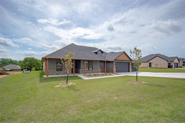 1431 County Road 2977, Blanchard, OK 73010 - view of front facade featuring driveway, an attached garage, stone siding, and a front lawn