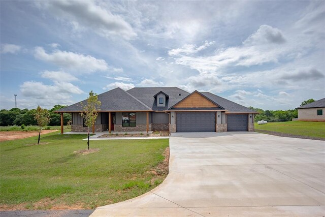 1431 County Road 2977, Blanchard, OK 73010 - craftsman-style home featuring an attached garage, concrete driveway, a front yard, and stone siding