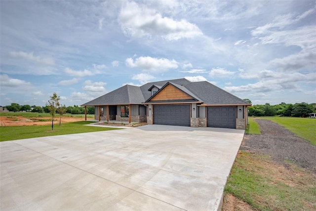 1431 County Road 2977, Blanchard, OK 73010 - view of front of property with a garage, a front lawn, concrete driveway, and stone siding