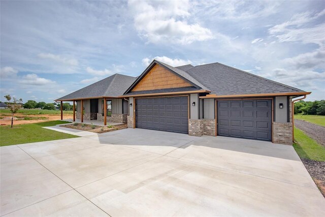 1431 County Road 2977, Blanchard, OK 73010 - view of front of property with an attached garage, concrete driveway, brick siding, and a front lawn