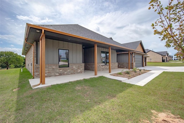 1431 County Road 2977, Blanchard, OK 73010 - rear view of house with board and batten siding, a garage, driveway, a lawn, and a shingled roof