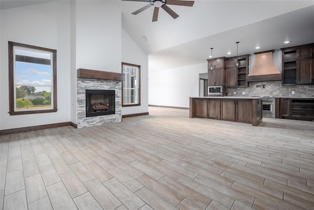 1431 County Road 2977, Blanchard, OK 73010 - kitchen with custom range hood, ceiling fan, open floor plan, high vaulted ceiling, and open shelves