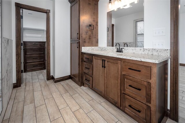 1431 County Road 2977, Blanchard, OK 73010 - bathroom featuring vanity and wood finished floors