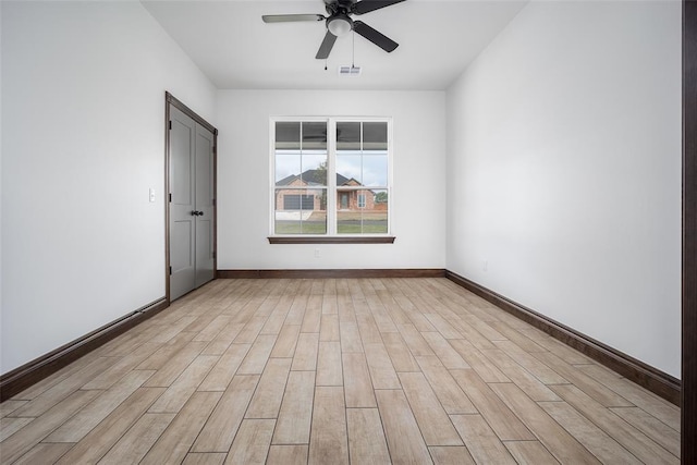 1431 County Road 2977, Blanchard, OK 73010 - spare room with a ceiling fan and light wood-style floors