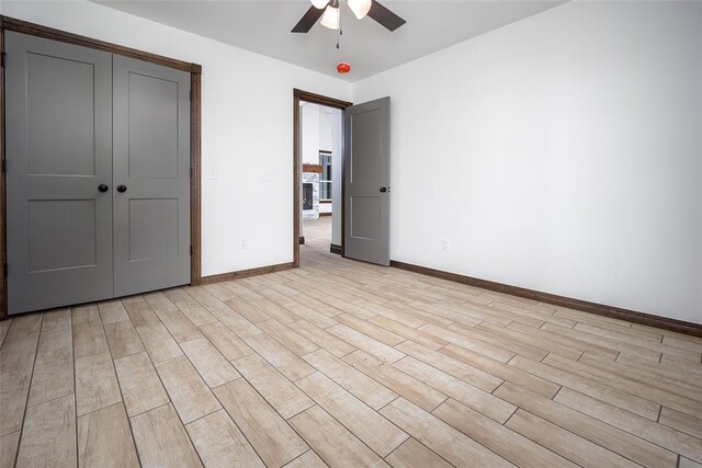 1431 County Road 2977, Blanchard, OK 73010 - unfurnished bedroom with light wood-style flooring, ceiling fan, and a closet