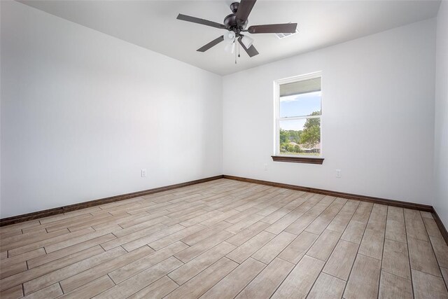 1431 County Road 2977, Blanchard, OK 73010 - empty room with light wood finished floors and ceiling fan