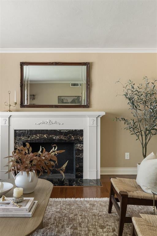 1716 Westminster Pl, Nichols Hills, OK 73120 - detailed view of a fireplace, wood finished floors, and crown molding