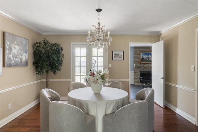 1716 Westminster Pl, Nichols Hills, OK 73120 - dining room featuring a chandelier, wood finished floors, and ornamental molding