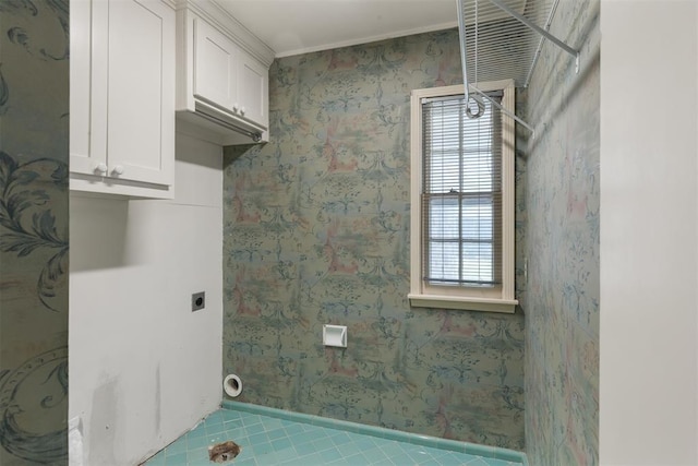 1716 Westminster Pl, Nichols Hills, OK 73120 - laundry room with electric dryer hookup, plenty of natural light, cabinet space, tile patterned floors, and ornamental molding