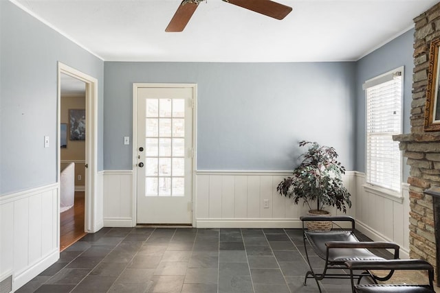 1716 Westminster Pl, Nichols Hills, OK 73120 - entryway with a ceiling fan, wainscoting, plenty of natural light, and dark tile patterned floors