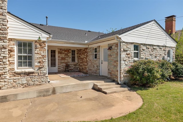 1716 Westminster Pl, Nichols Hills, OK 73120 - doorway to property featuring a chimney, stone siding, a lawn, and a patio