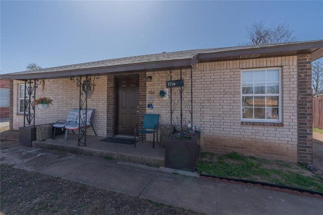 view of front of home featuring brick siding