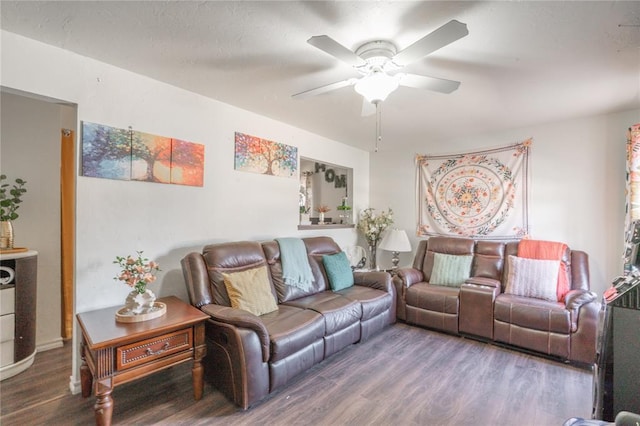 living area featuring wood finished floors and a ceiling fan