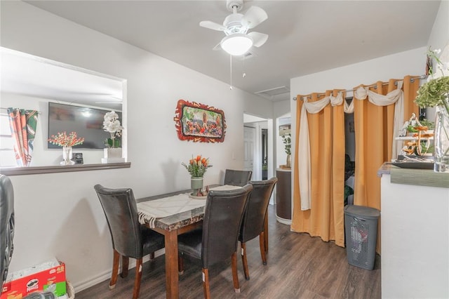dining space with baseboards, ceiling fan, and wood finished floors