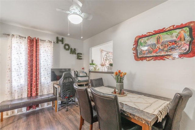 dining area featuring ceiling fan and wood finished floors
