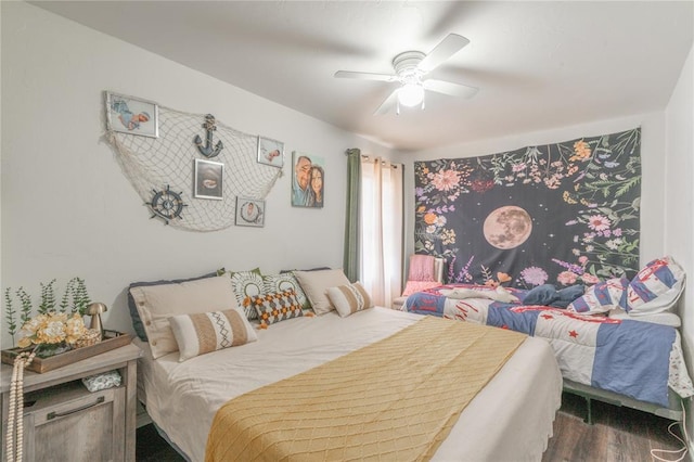 bedroom featuring a ceiling fan and wood finished floors