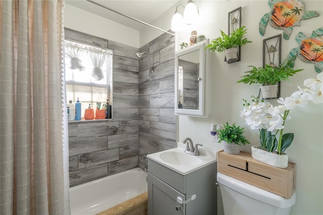 full bath with shower / tub combo, toilet, and vanity