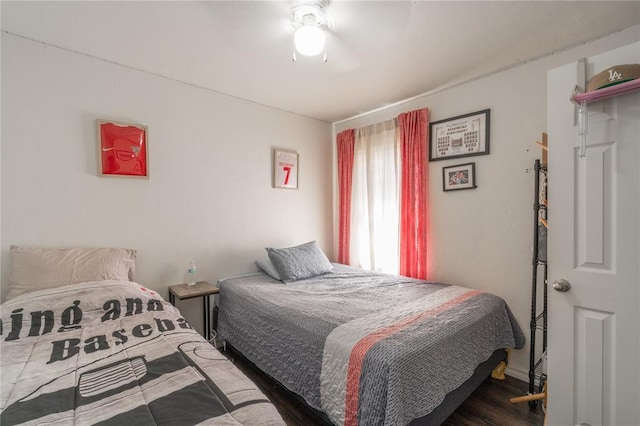bedroom featuring wood finished floors and ceiling fan