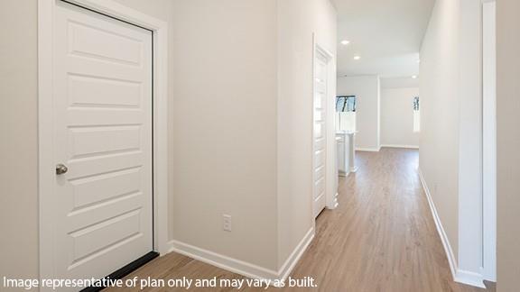 8313 NW 61st St, Oklahoma City, OK 73132 - corridor featuring recessed lighting, wood finished floors, and baseboards