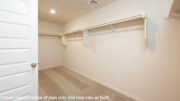8313 NW 61st St, Oklahoma City, OK 73132 - walk in closet featuring carpet and visible vents