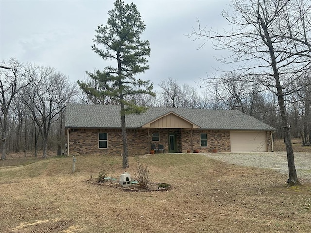 114495 S 4296th Rd, Porum, OK 74455 - view of front of home featuring driveway, a shingled roof, and a garage