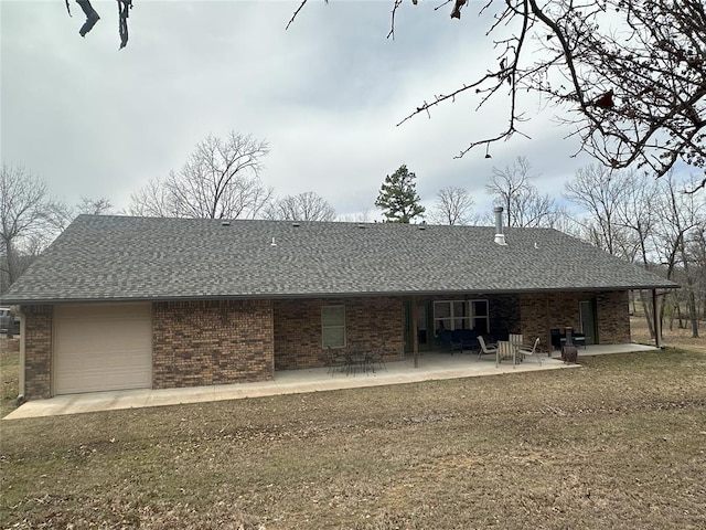 114495 S 4296th Rd, Porum, OK 74455 - back of house with a patio, brick siding, a garage, and a shingled roof