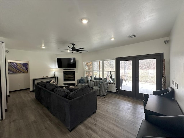 114495 S 4296th Rd, Porum, OK 74455 - living area featuring french doors, wood finished floors, baseboards, visible vents, and ceiling fan