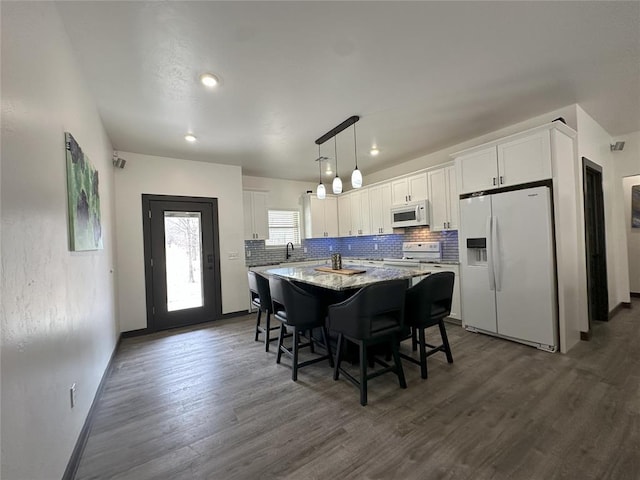 114495 S 4296th Rd, Porum, OK 74455 - kitchen with dark wood-style flooring, white cabinets, and white appliances