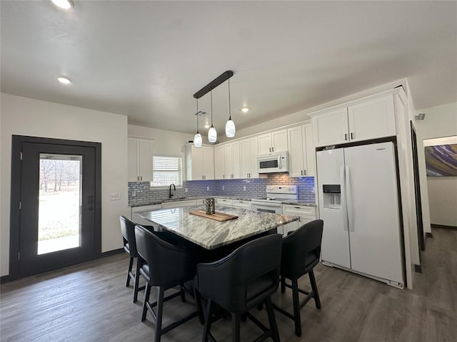 114495 S 4296th Rd, Porum, OK 74455 - kitchen with white cabinets, a sink, a center island, and white appliances