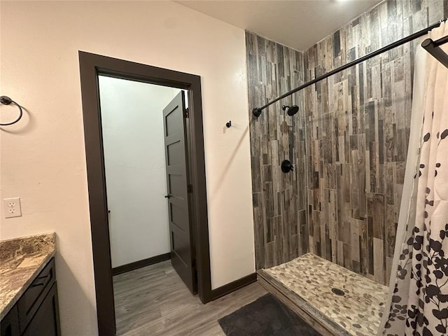 114495 S 4296th Rd, Porum, OK 74455 - full bath with vanity, baseboards, wood finished floors, and tiled shower