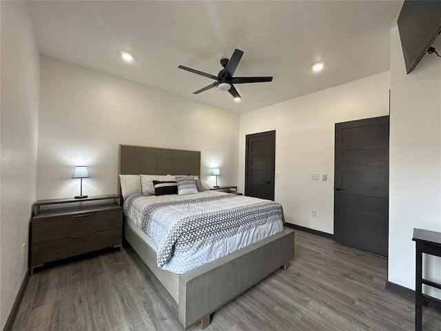 114495 S 4296th Rd, Porum, OK 74455 - bedroom featuring baseboards, wood finished floors, and a ceiling fan