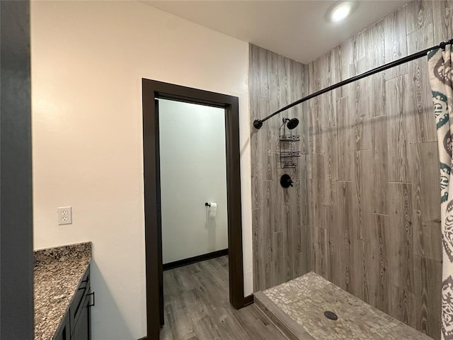114495 S 4296th Rd, Porum, OK 74455 - full bathroom featuring baseboards, a tile shower, vanity, and wood finished floors