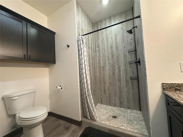 114495 S 4296th Rd, Porum, OK 74455 - bathroom with vanity, toilet, baseboards, a stall shower, and wood finished floors