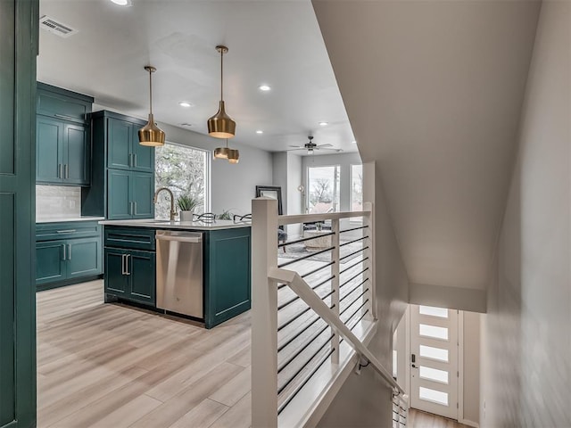 kitchen with light countertops, ceiling fan, dishwasher, light wood-style flooring, and visible vents