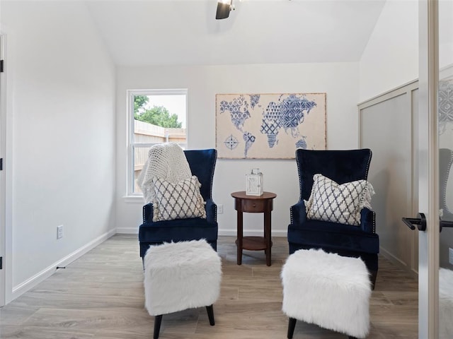 12712 NW 1st Ct, Yukon, OK 73099 - living area featuring light wood-style floors, a ceiling fan, vaulted ceiling, and baseboards