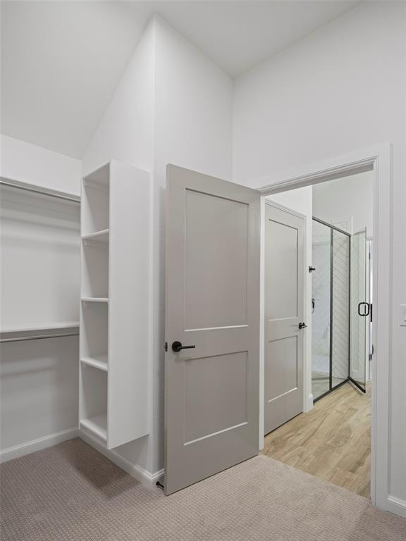 12712 NW 1st Ct, Yukon, OK 73099 - walk in closet with light wood-style floors