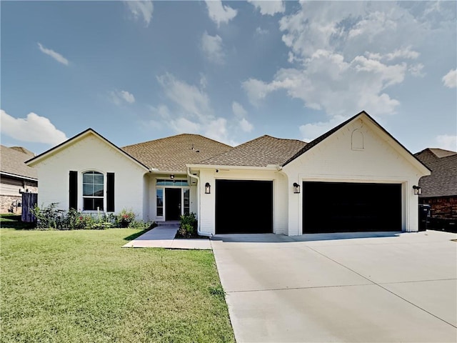 single story home featuring an attached garage, driveway, a front lawn, and roof with shingles