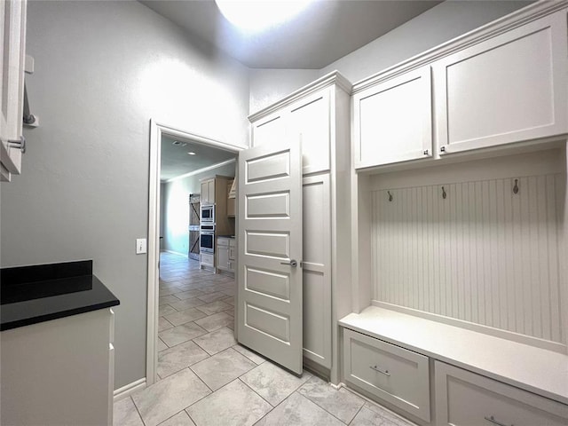 mudroom featuring baseboards