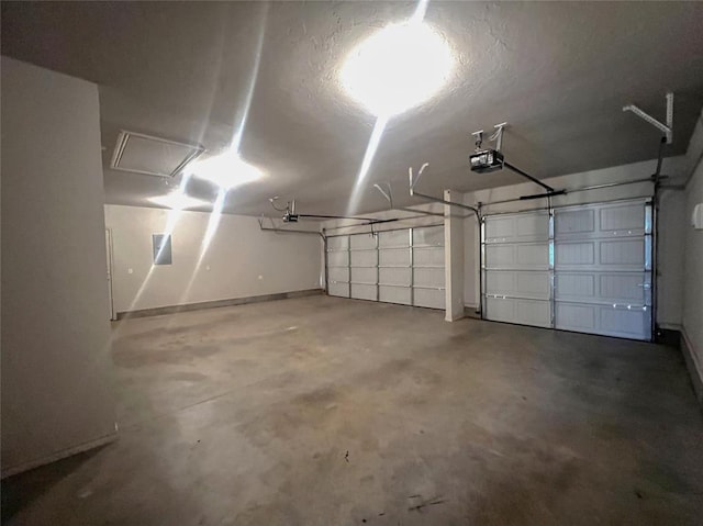 garage with a garage door opener and baseboards