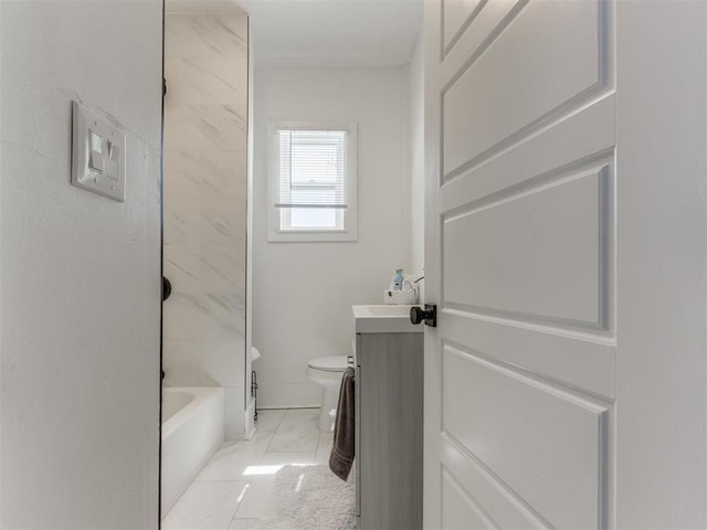 bathroom with marble finish floor, toilet, and vanity