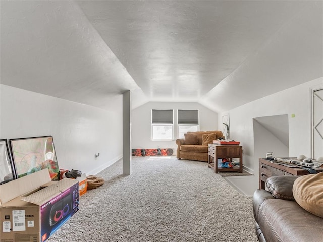 rec room featuring baseboards, vaulted ceiling, carpet floors, and a textured ceiling