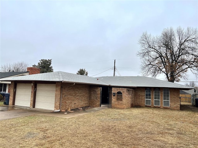 1413 NW 106th St, Oklahoma City, OK 73114 - single story home with an attached garage, a chimney, brick siding, and concrete driveway