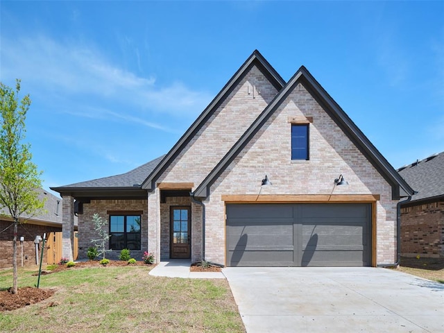 12729 NW 2nd Ter, Yukon, OK 73099 - view of front of house featuring driveway and brick siding