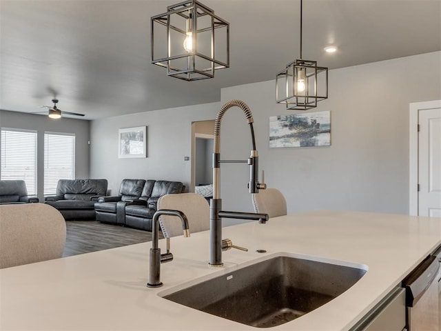 8129 NW 153rd St, Edmond, OK 73013 - kitchen with light countertops, open floor plan, decorative light fixtures, and a sink