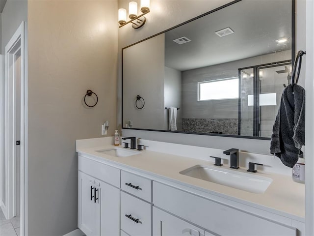 8129 NW 153rd St, Edmond, OK 73013 - bathroom featuring double vanity and a tile shower