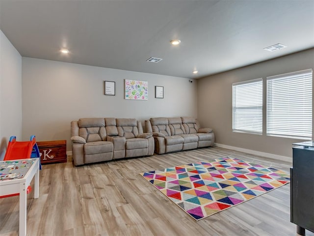 8129 NW 153rd St, Edmond, OK 73013 - living room with wood finished floors, baseboards, and recessed lighting