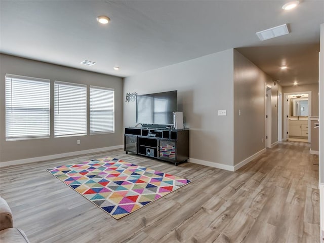 8129 NW 153rd St, Edmond, OK 73013 - living area featuring light wood finished floors, baseboards, and recessed lighting